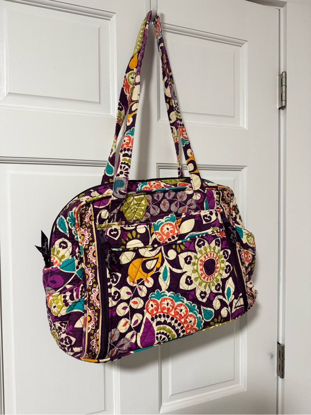 Vera Bradley diaper bag in the print “plum crazy”
